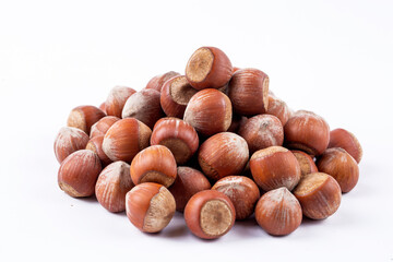 Shelled hazelnuts on the white background