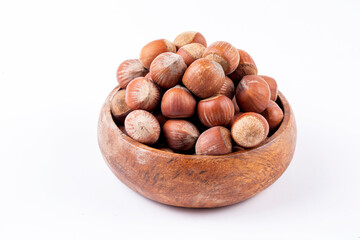 Shelled hazelnuts on the white background