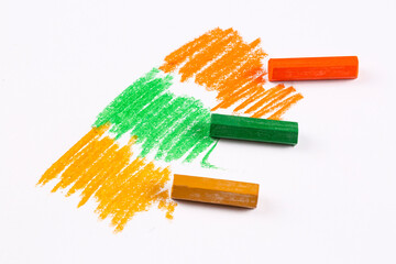 Colorful pastel crayons with painting background