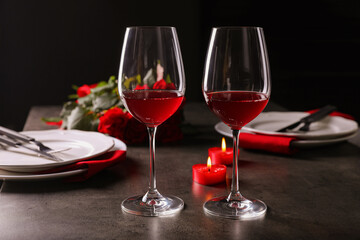 Beautiful place setting for romantic dinner on grey table