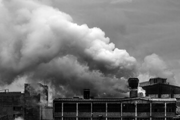 Old factory polluting the atmosphere with smoke and smog