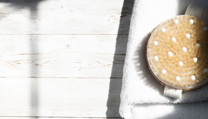 Dry massage body brush, minimalism, copy space
