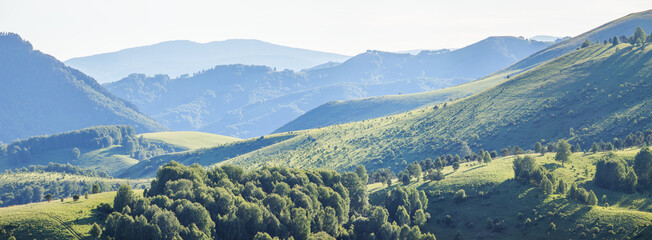 Mountain landscape, green mountains and hazy hills, panoramic view
