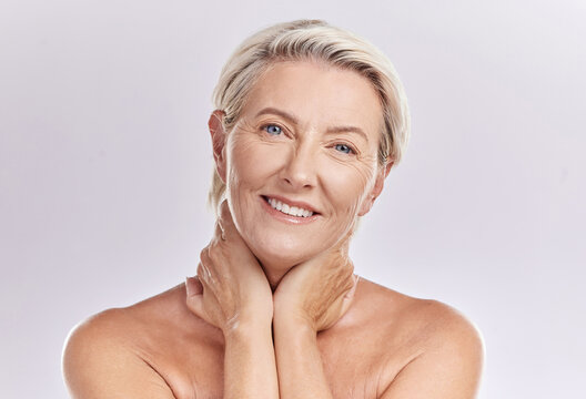 Skincare, smile and mature happy woman in beauty, face and health in a studio background. Portrait of an elderly model lady in wellness, health and cosmetics with beautiful teeth, skin and eyes.