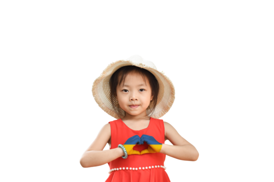 Little girl wear hat showing heart sign with his hands painted in Ukraine flag color isolated on transparent background - PNG format. Stop the war for peace. Love Ukraine concept.