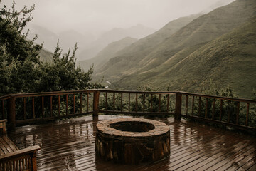 Fototapeta premium fire pit overlooking mountain valley in lesotho africa