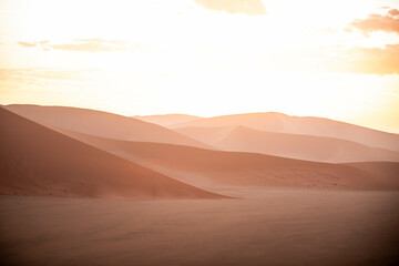 dramatic sunset over sand dunes in namibia - obrazy, fototapety, plakaty