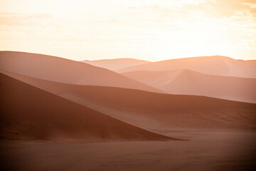 Fototapeta premium dramatic sunset over sand dunes in namibia