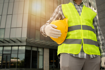 construction worker holding a helmet