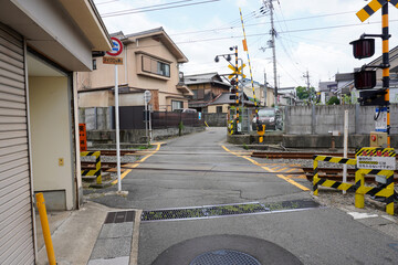 Local train roadway and grade crossing in Uji, Kyoto, Japan