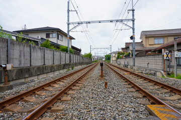 Fototapeta premium Local train roadway and grade crossing in Uji, Kyoto, Japan