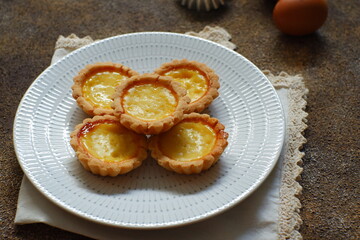milk tarts on the wooden background 