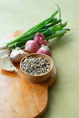 selective focus of pepper in a wooden bowl