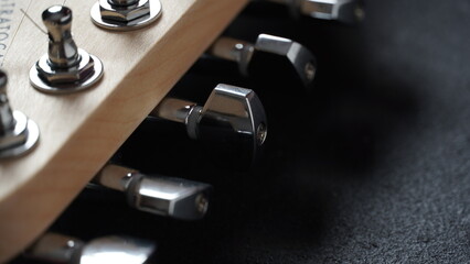 Close up of an acoustic guitar tuning keys