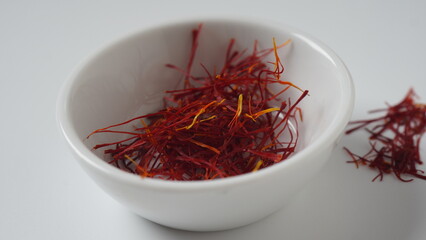 Expensive Red Dried saffron spice   in a bowl