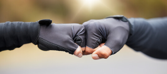 Motivation, teamwork and unity with hands in gloves fist bump to show collaboration, solidarity and...