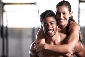 Fototapeta na wymiar Fitness couple, gym friends and team hugging, holding and celebrating successful workout, training and exercise together. Portrait of smiling, happy and healthy man and woman after wellness teamwork
