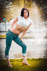 woman in the park standing in front of a fountain
