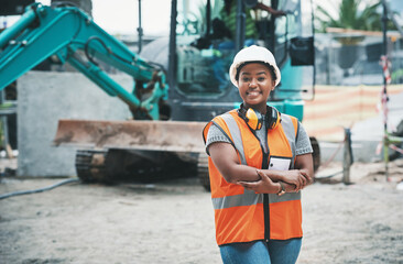 Happy woman construction worker with a ready to work smile on a job site outside. Portrait of a...