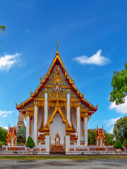 Fototapeta premium Beautiful Wat Chalong Buddhist temples in Phuket Thailand. Decorated in beautiful ornate colours of red and Gold and Blue. Lovely Sky