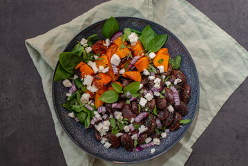 Vegetable salad in bowl, avocado, sweet potato, beans