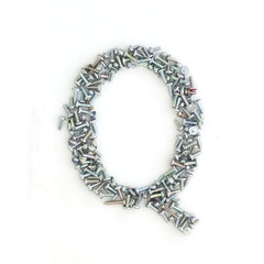 Capital letter Q made from screws and bolts. Alphabet made from used screws. White background. Industrial bolt font