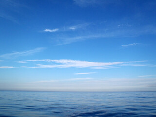 Naklejka na ściany i meble Sunny blue sky with sea horizon texture.