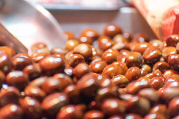 Candied fried chestnuts at a street food stall