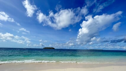 Turquoise sea water and cloudy blu sky. Travel vacatuin background