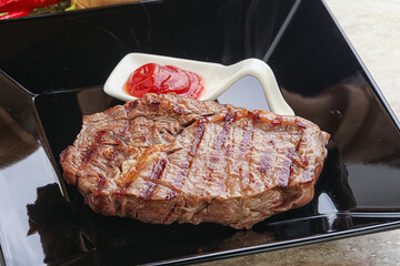 Grilled rib-eye steak beef meat