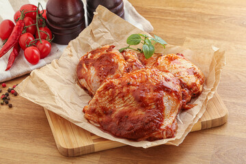 Marinated chicken leg in tomato sauce
