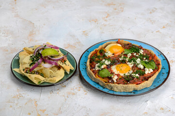 shakshuka in dough in a blue plate on a white background
