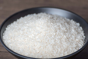 Oats, rice in bamboo baskets, wooden spoons, bowls, rice jars