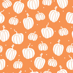Beautiful seamless pattern of autumn Halloween pumpkins, cute white pumpkins and dots, orange background, print for seasonal textile prints, backgrounds or wallpapers.