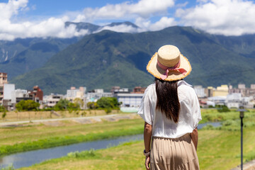 Woman look at the scenery landscape view in Taiwan