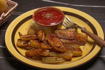 Salt-grilled potatoes with tomato sauce. Fast food restaurant