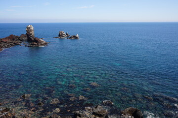 clear sea and rock island