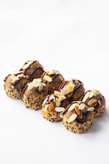 fried sushi rolls with sauce and almonds on white background for menu