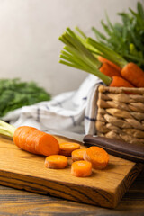 Slice carrot.Fresh carrots on brown texture background. Ingredient for salad.Vegetarian organic vegetables.Healthy food.Copy space.Place for text