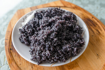 Traditional Chinese food cooked on a plate - black rice