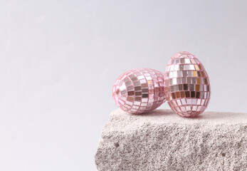 Mirror eggs on the stone. Easter abstract composition