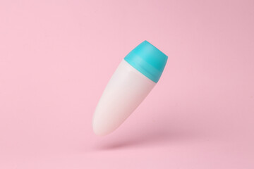 Antiperspirant stick mockup flying in antigravity on pink background with shadow. Levitation object in the air. Beauty concept. Creative minimal layout