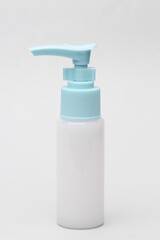 Cream dispenser bottle on white background