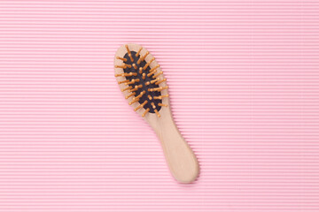 Eco hair brush on a pink background.