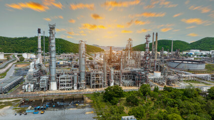 Fototapeta premium Oil Refinery Gas Chemical Equipment Prodiction import export Concept, Crude Oil Refinery Plant Steel Pump Pipe line and Tank and Cooling tower, Chemical or Petrochemical Factory plant, industry
