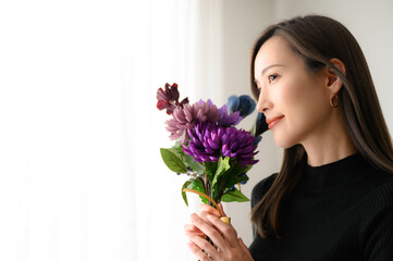 Beautiful Asian woman with purple flowers Easy to use in fall