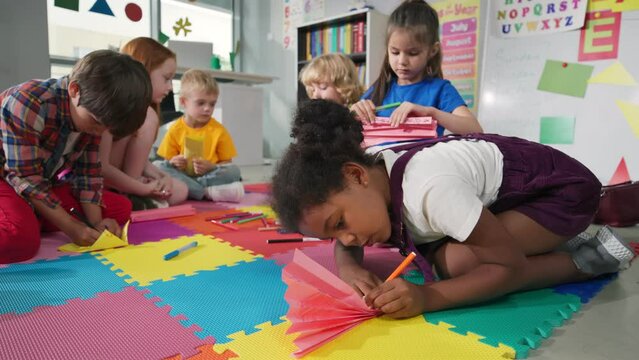 Multiethnic preschoolers having art class in kindergarten