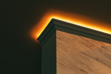Low angle picture of ceiling and a part of wall being lighten by the led lights