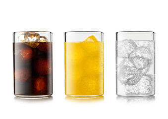 Cola soft drink with orange and lemonade soda with ice cubes and bubbles on white background.