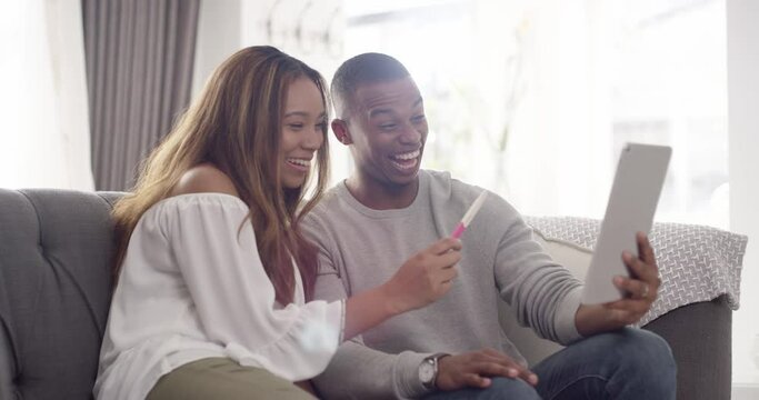 Excited pregnant couple video call on digital tablet phone share good news about expecting baby on living room home sofa. Happy black woman and man hold positive pregnancy test start family together.
